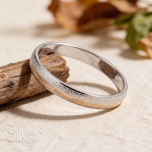 65% purity silver bracelet for him featuring a Greek-key geometric engraved border and detailed layered bands, displayed on a wooden surface.