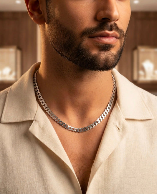 Man wearing a 925 sterling silver men's chain with faceted interlocking curb links and a 20-inch fit.