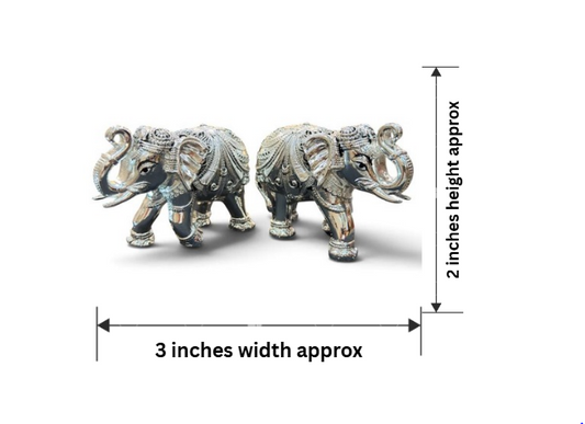 999 pure silver plated elephant gifting idol pair shown from the front, featuring ornate relief detailing and raised decorative elements, approximately 2 inches high and 3 inches wide.