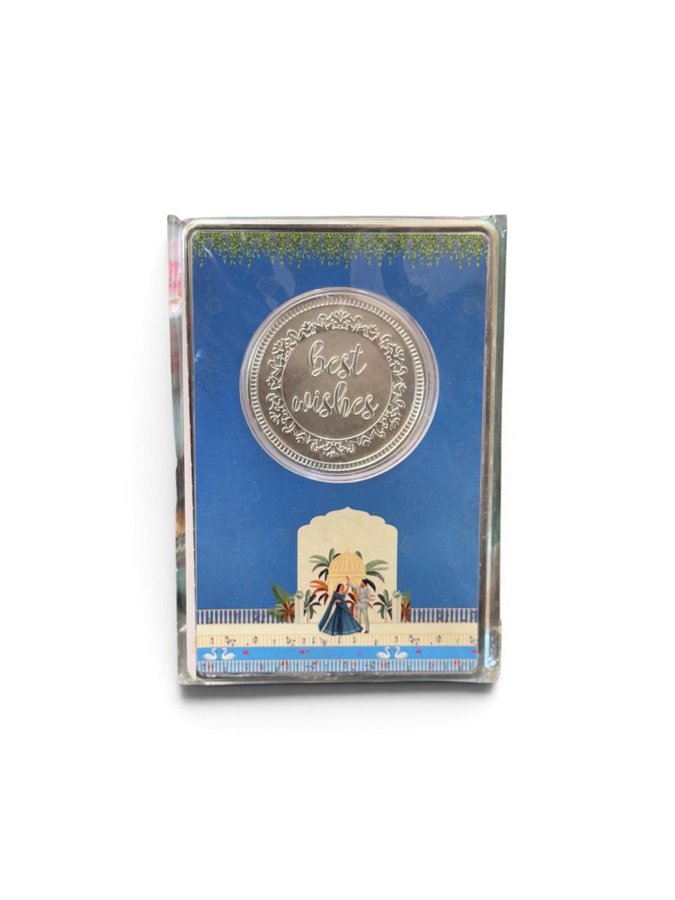 Gifting item with 999 pure silver plated coating featuring a round Best Wishes coin with floral border in a blue decorative card.