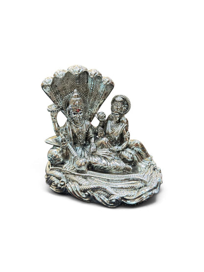 Gifting Items with 999 pure silver plated coating featuring two seated figures under a detailed Sheshnag canopy on an ornate base.