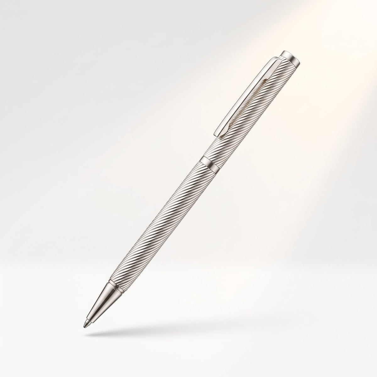 Floating studio view of a 925 sterling silver ballpoint pen with diagonal ribbed body and pocket clip.