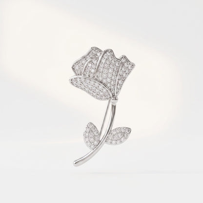 Front view of 925 sterling silver rose flower brooch with stone studded petals on white background.