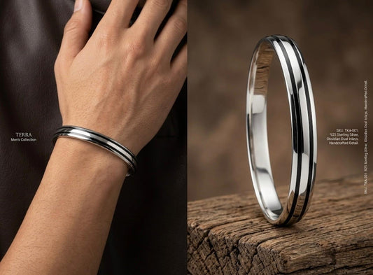 925 silver men's kada with dual dark stripe inlays and polished finish, worn around the wrist.