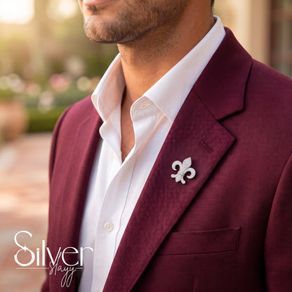 925 sterling silver fleur-de-lis lapel pin worn on maroon suit blazer for men.