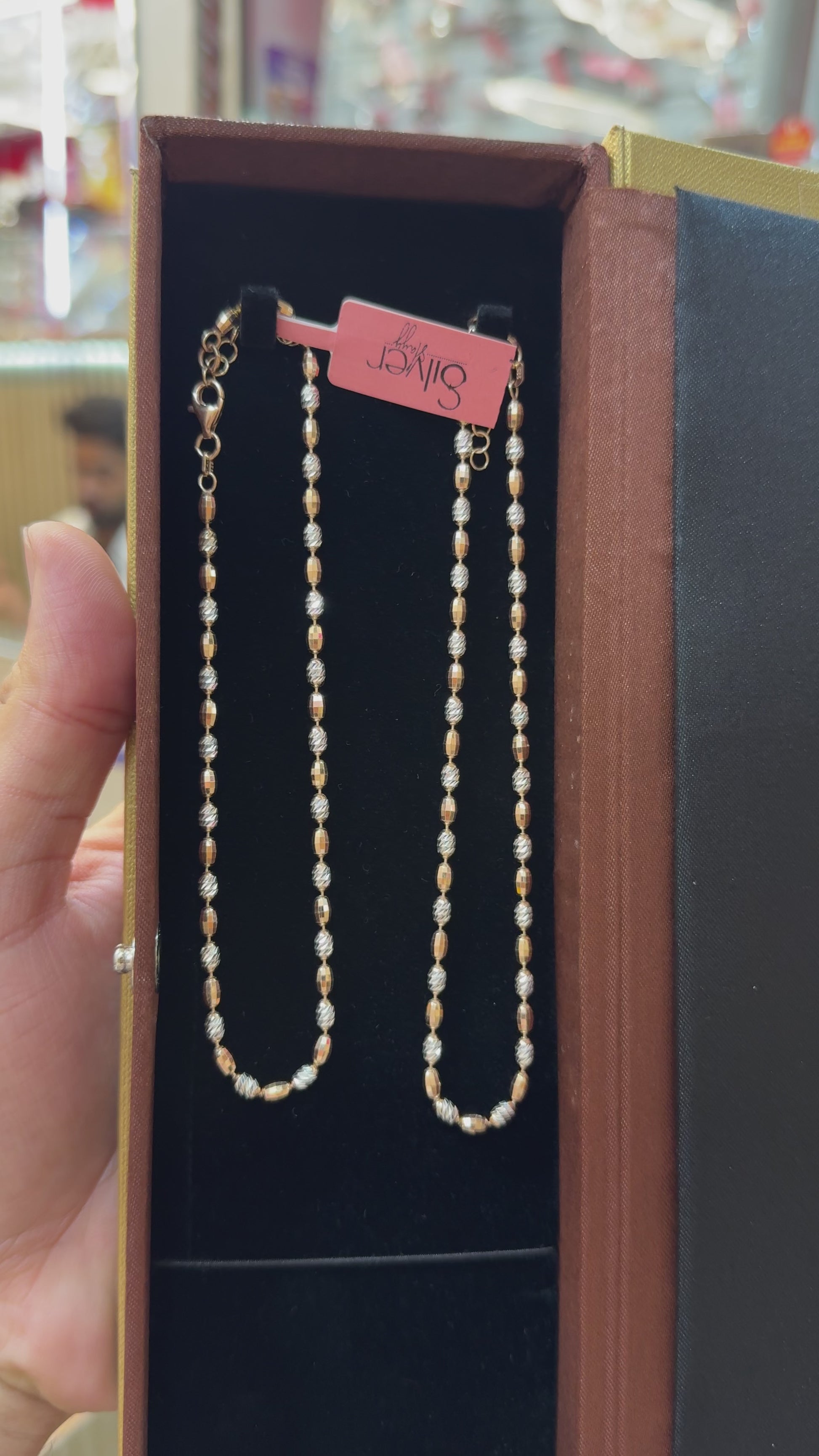 Video showcasing a 925 Sterling Silver beaded anklet in a luxury gift box with a detailed close-up of the polished bead design.