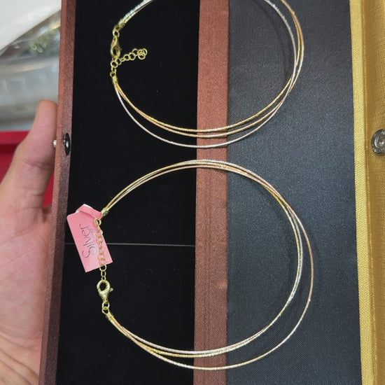 Close-up video of a 92.5 sterling silver triple-strand anklet displayed in a jewelry box, highlighting the layered chain design and adjustable clasp.